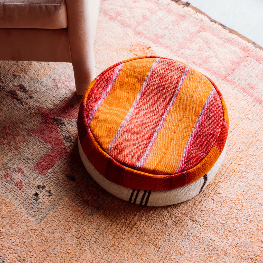 Small multicolor circular floor pillow