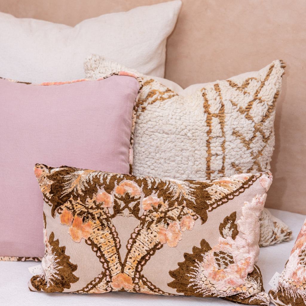 Decorative pillows with floral patterns on a couch
