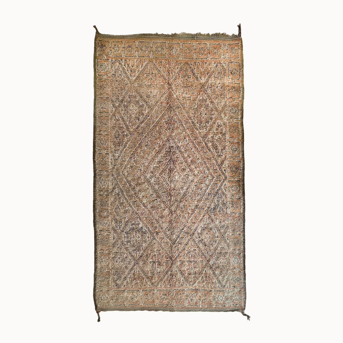 Decorative rug with intricate patterns on a white background