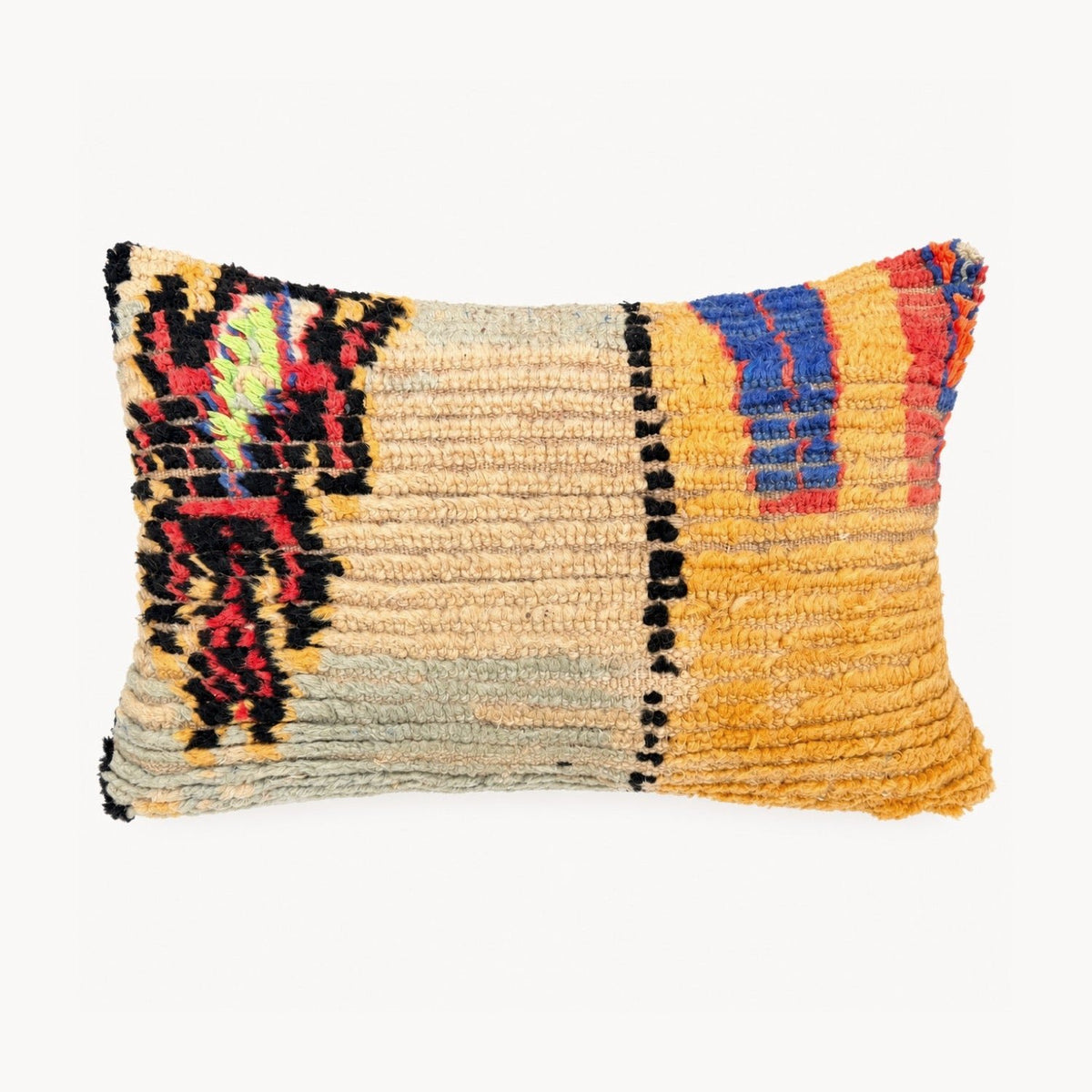 A rectangular decorative throw pillow with a textured, handwoven pattern in mustard yellow, beige, black, red, and blue, shown against a plain white background.